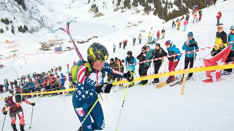 Skier running up hill during Wasatch Powderkeg race