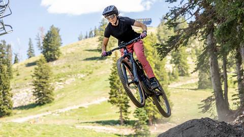 A mountain biker jumping on Quicksilver at Solitude Bike Park