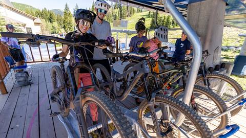 Mountain bikers putting bikes on the lift at Solitude Bike Park