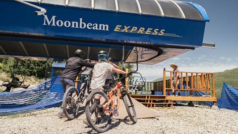 Friends getting ready to load Moonbeam Express to ride Solitude Bike Park