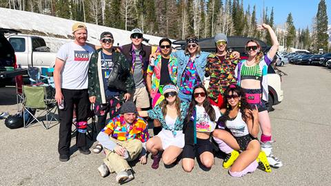 A group of friends celebrating closing day in the parking lot at Solitude Mountain Resort