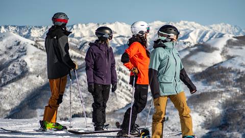 Friends skiing and snowboarding together at Solitude Mountain Resort